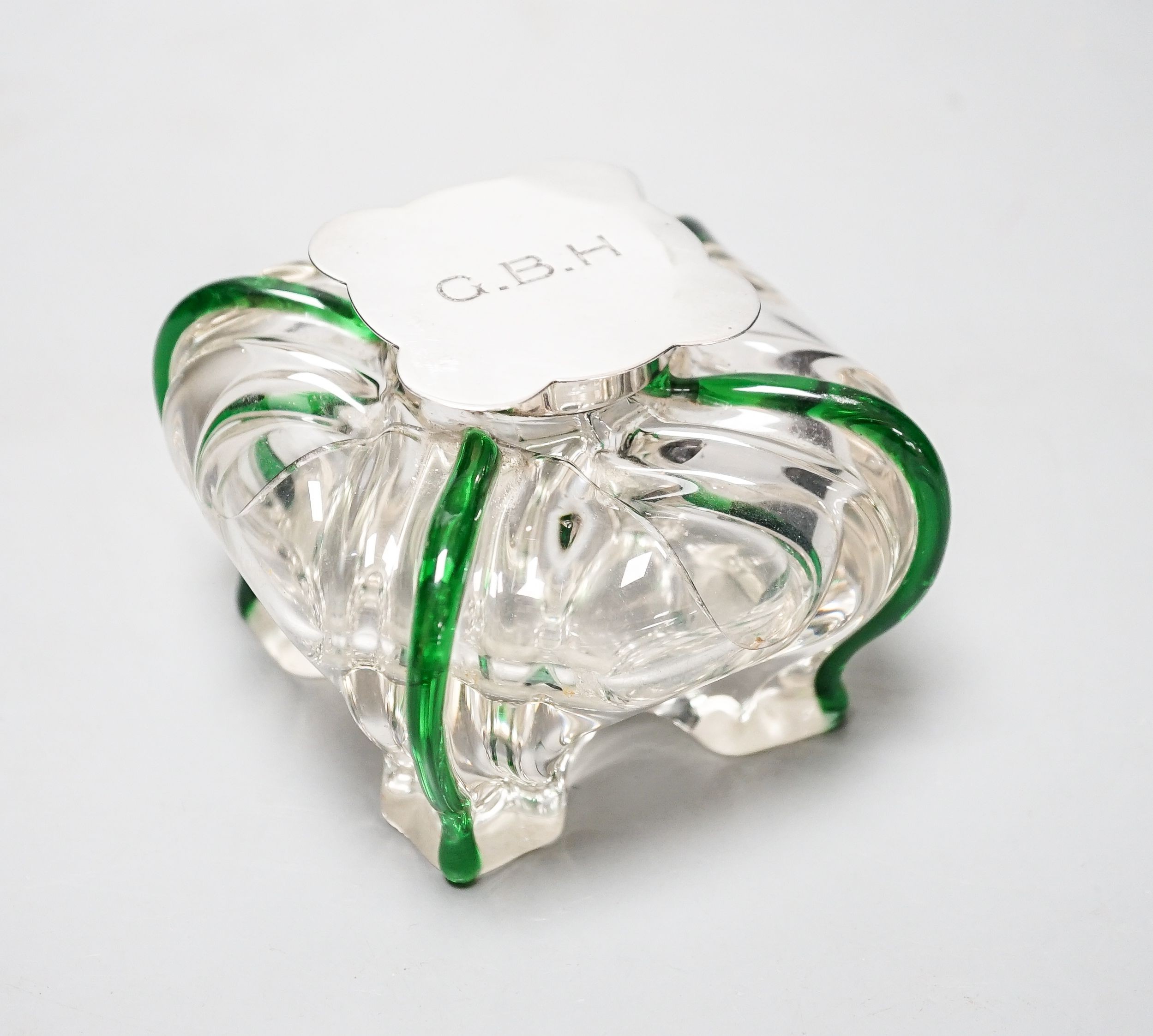 A silver-mounted green trailed glass inkwell, possibly Powell, Whitefriars. The lid initialled ‘G.B.H’ Height - 8cm